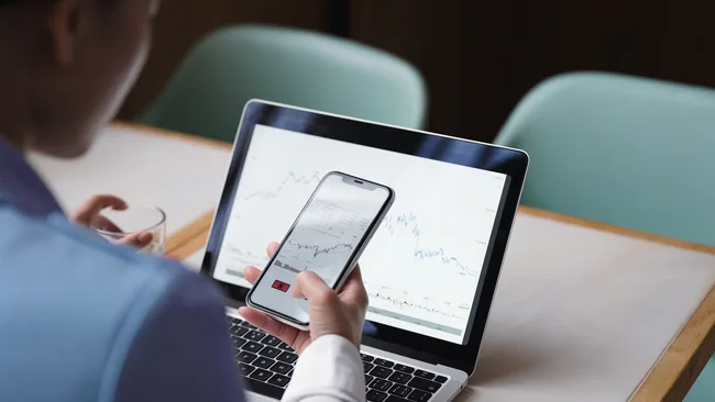 Woman with a phone and laptop 