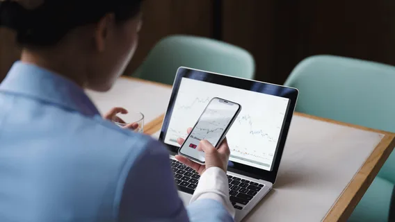Woman with a phone and laptop 
