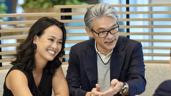 Three people sitting and talking