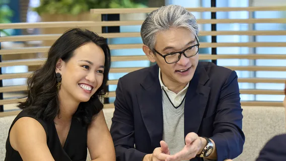 Three people sitting and talking