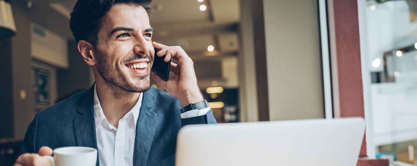 man on mobile phone smiling