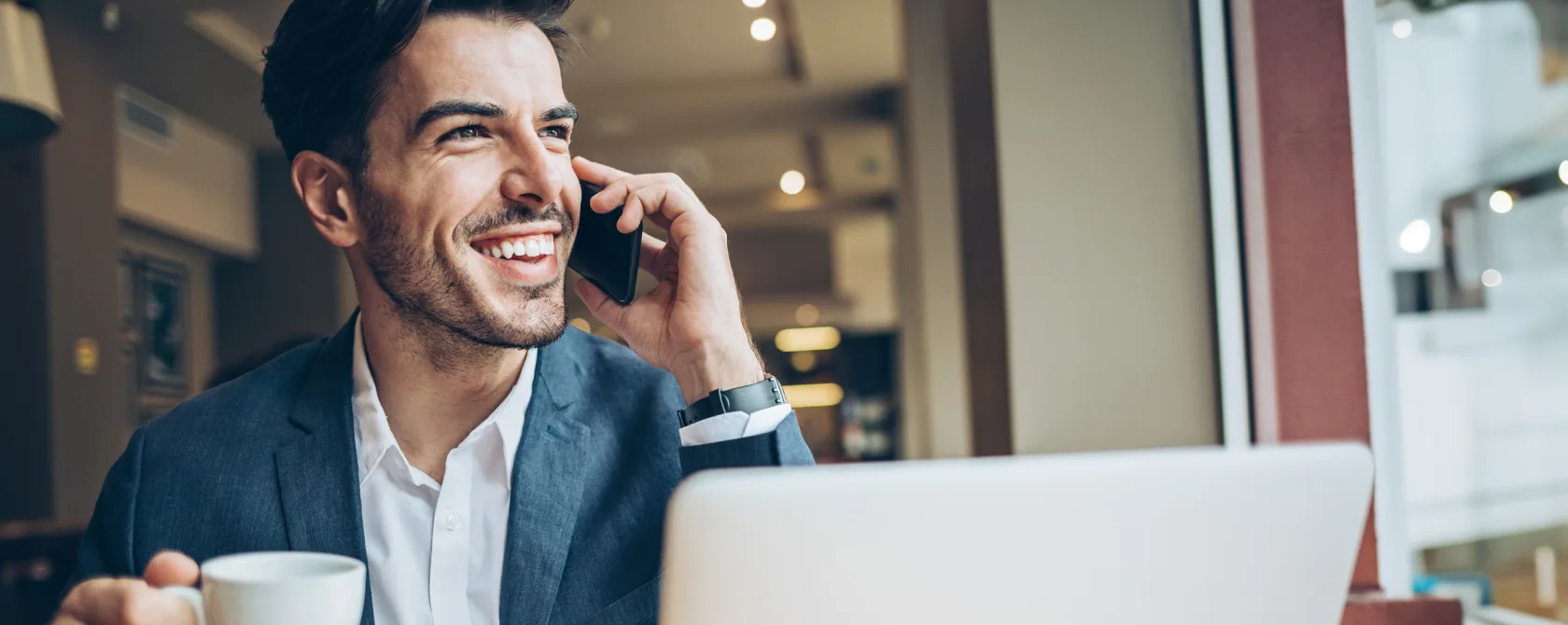 man on mobile phone smiling