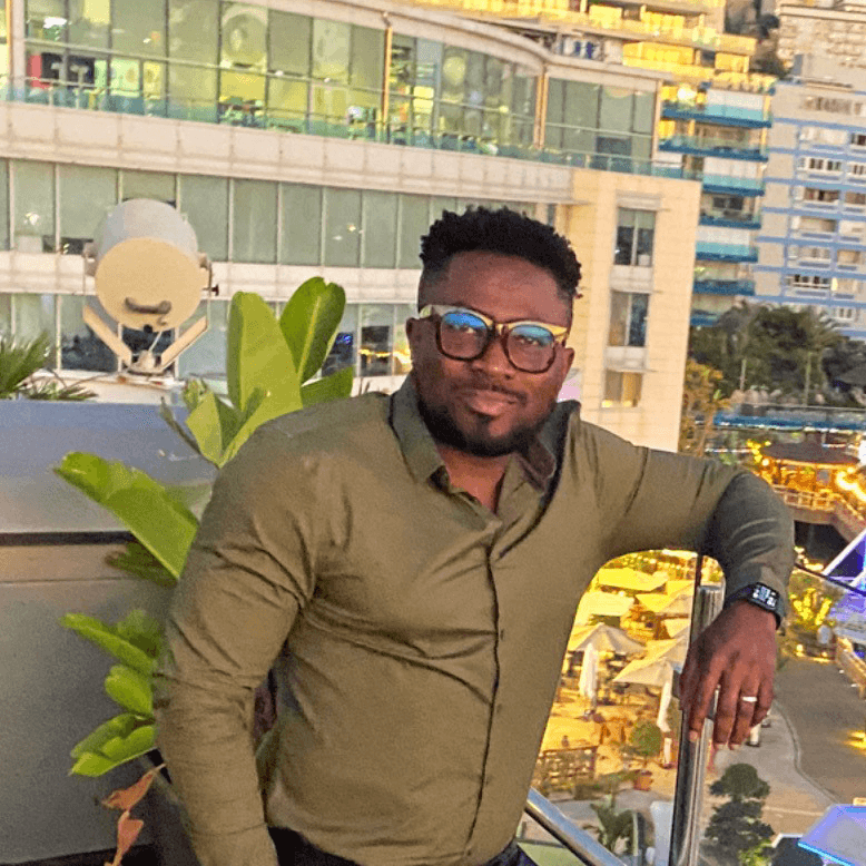 Jamel standing on a balcony