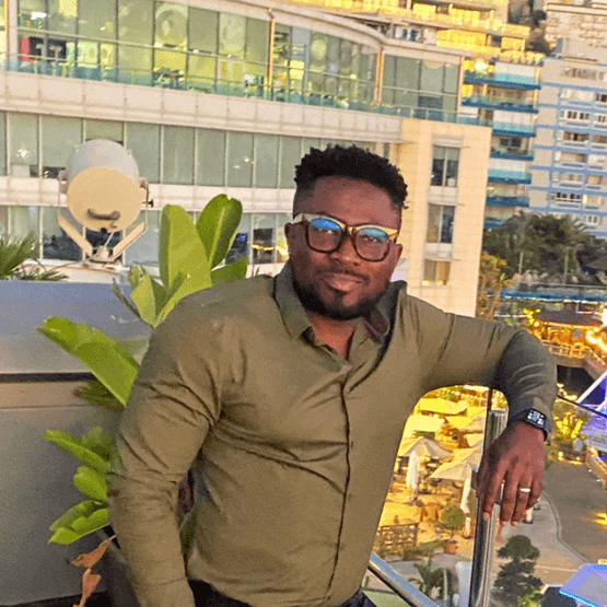 Jamel standing on a balcony