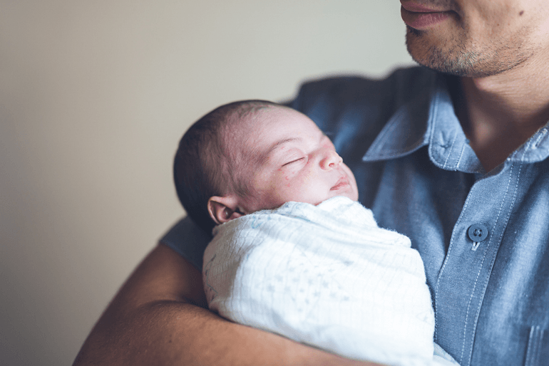 Man holding a baby
