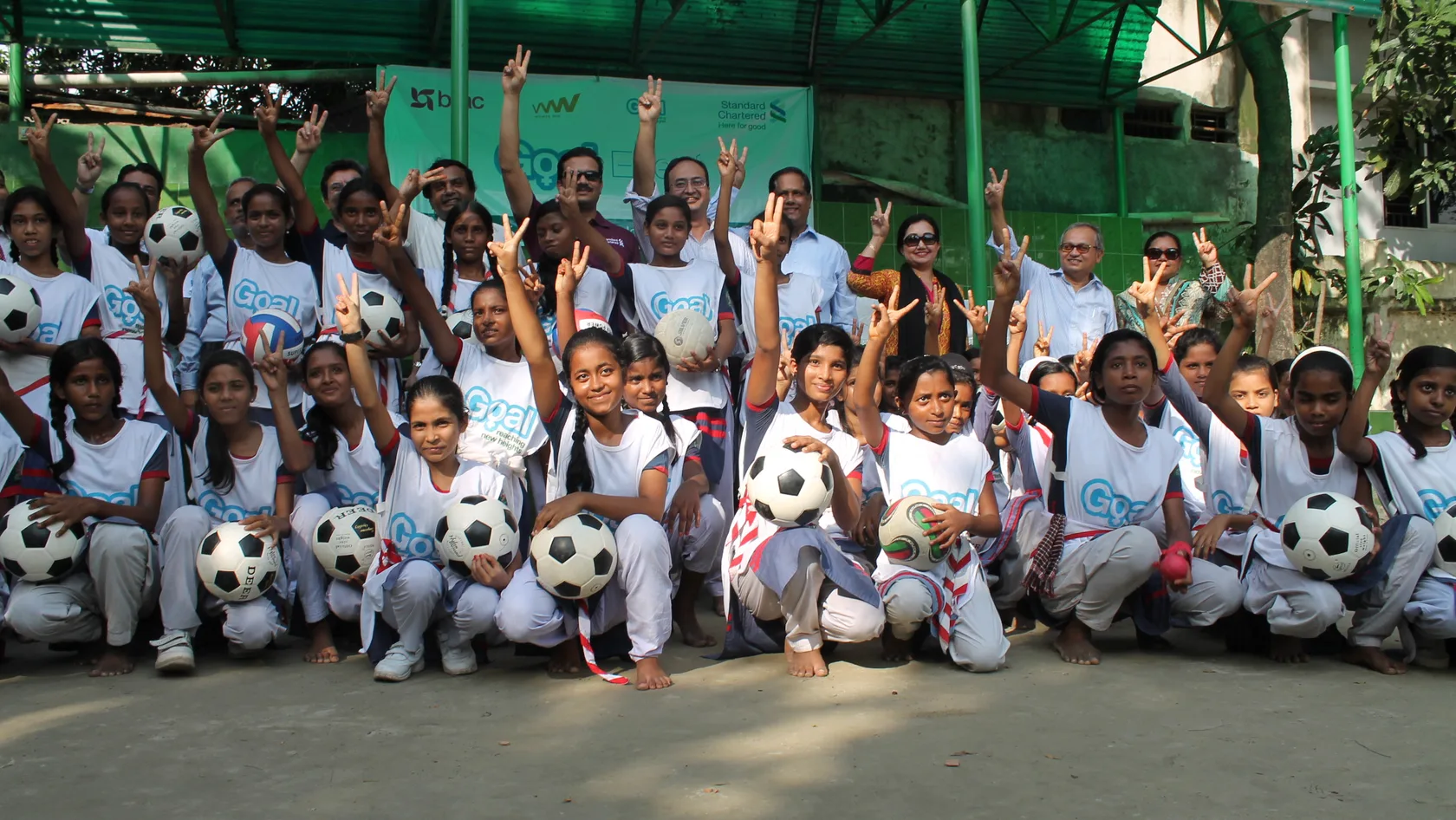 The Bangladesh Goal team show the peace sign
