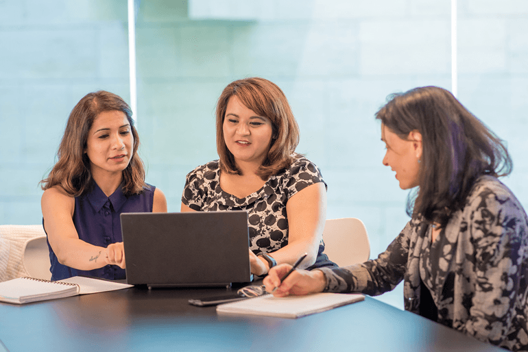 Three women in a meeting