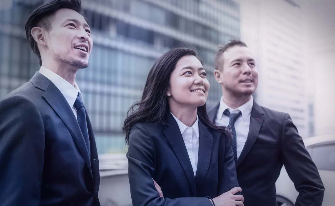 Two men and a woman in suits