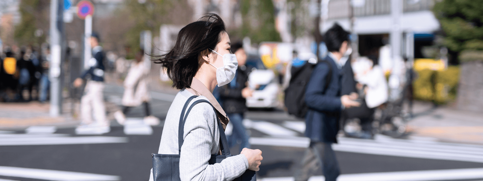 woman wearing mask walking
