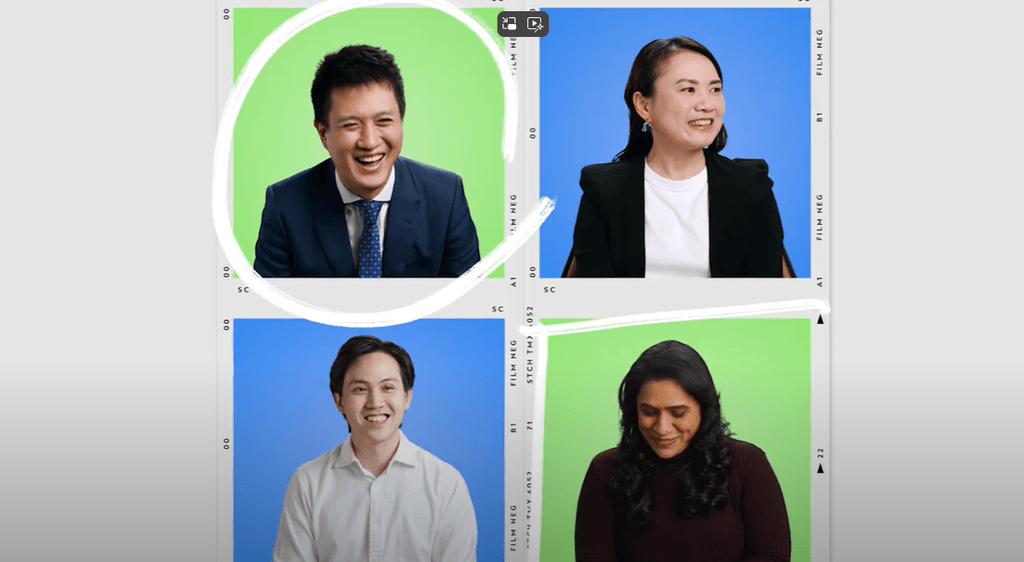 four colleagues smiling and laughing