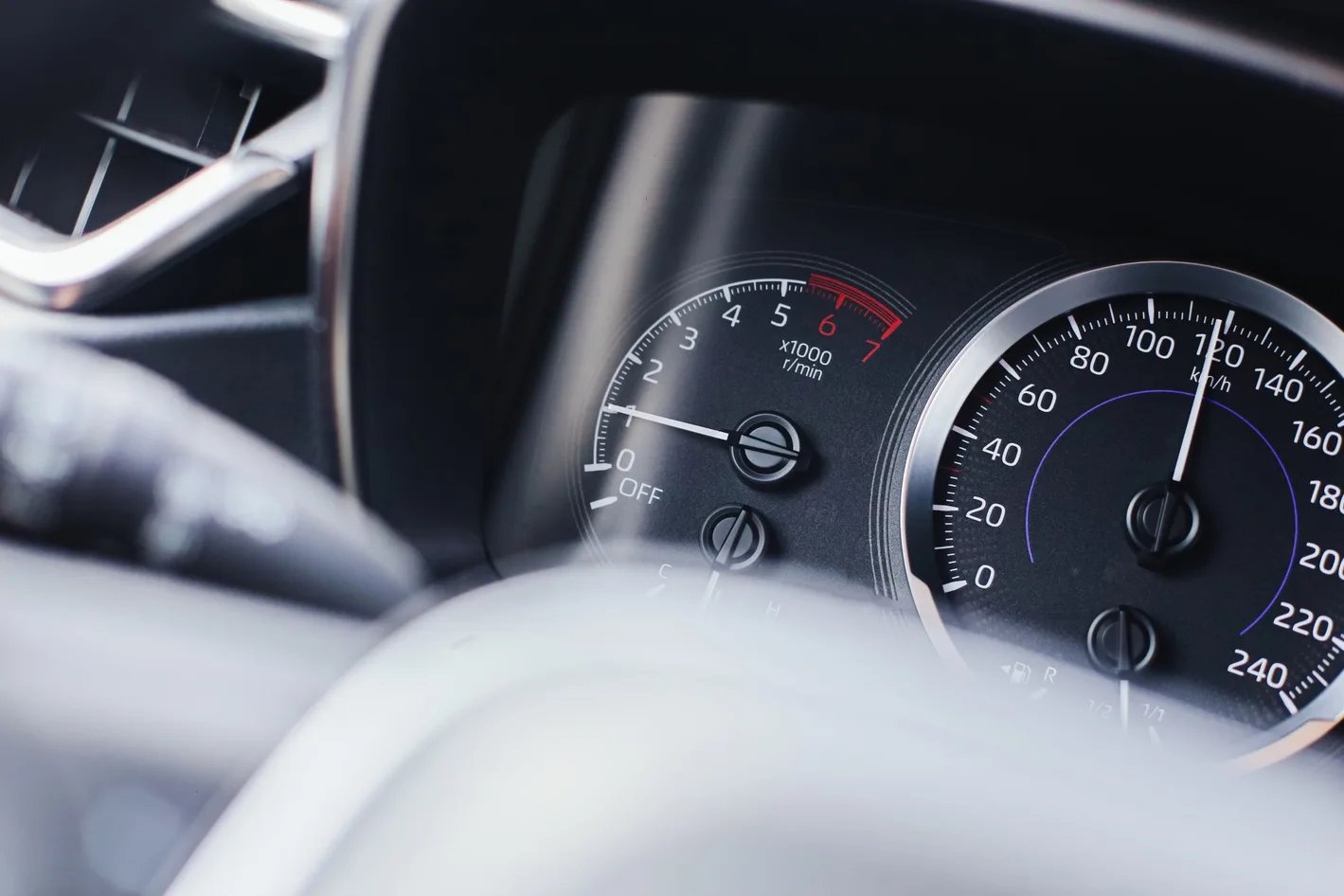 close up of car dashboard and odometer