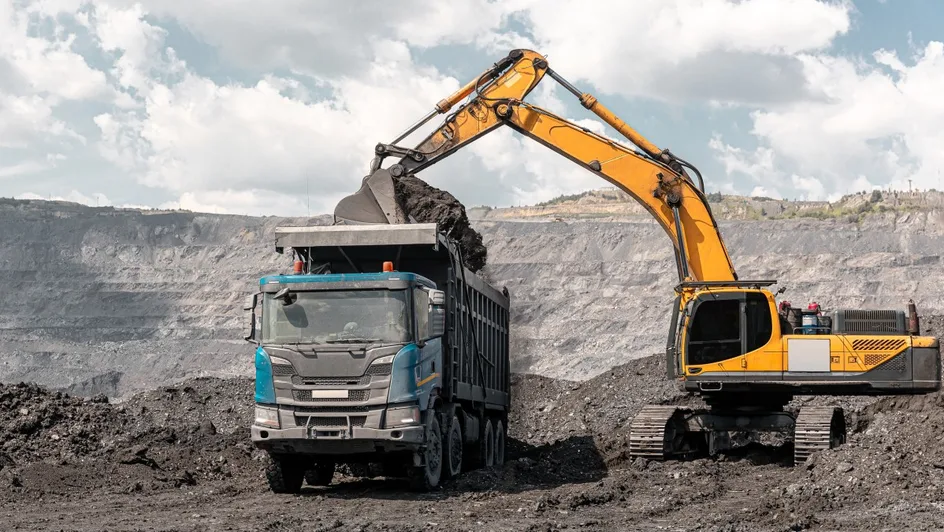 truck and digger in mining site