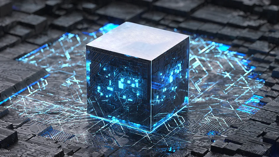 illuminated cube set amongst motherboards and computer chips