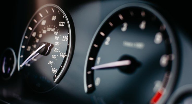 close-up image of a car speedometer and odometer