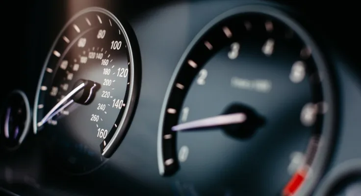 close-up image of a car speedometer and odometer