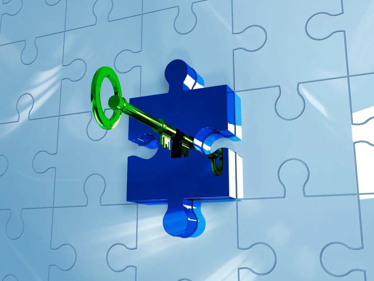 digital image of jigsaw puzzles with a key in one of the pieces