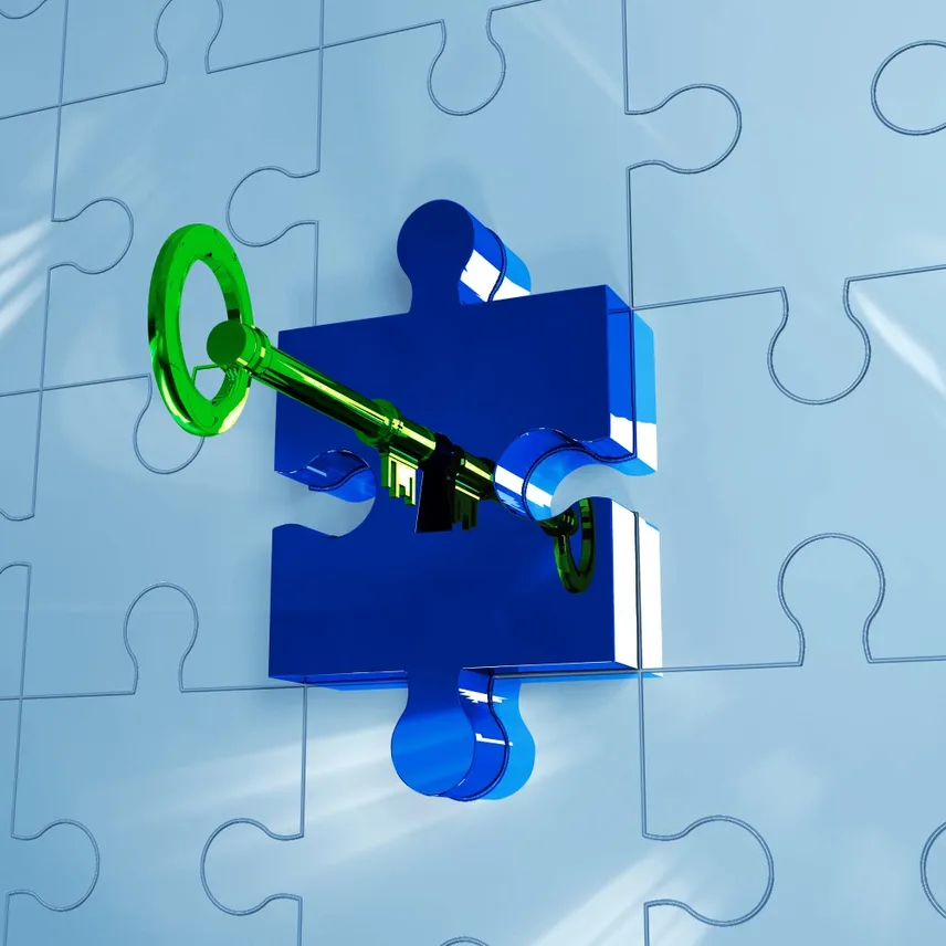 digital image of jigsaw puzzles with a key in one of the pieces