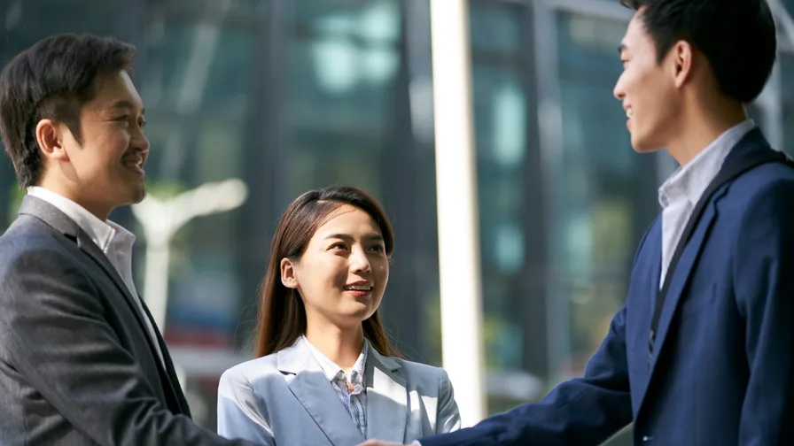 group of business people shaking hands