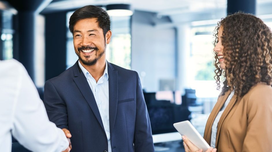 group of business people meeting and shaking hands