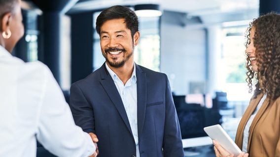 group of business people meeting and shaking hands