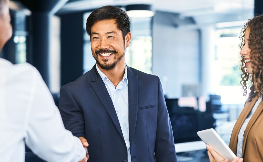 group of business people meeting and shaking hands