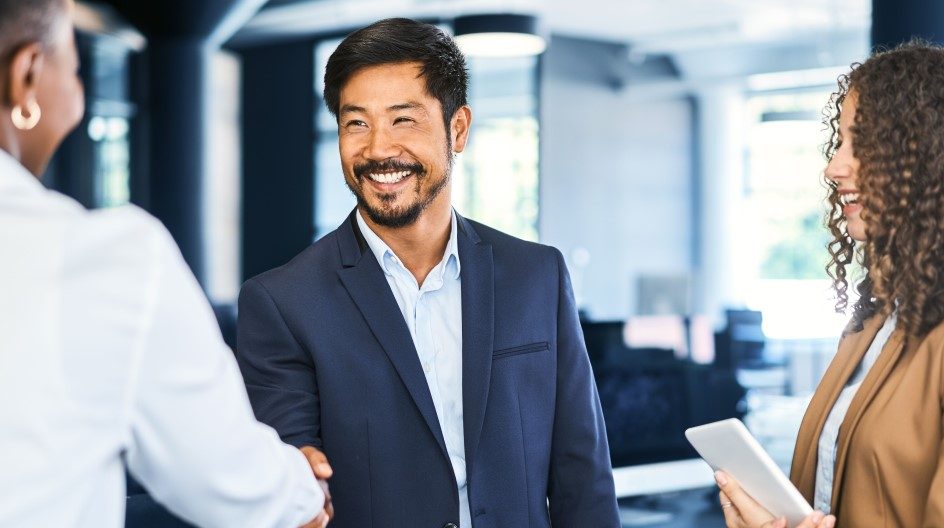 group of business people meeting and shaking hands