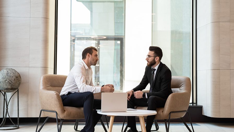 Two colleagues talking to each other