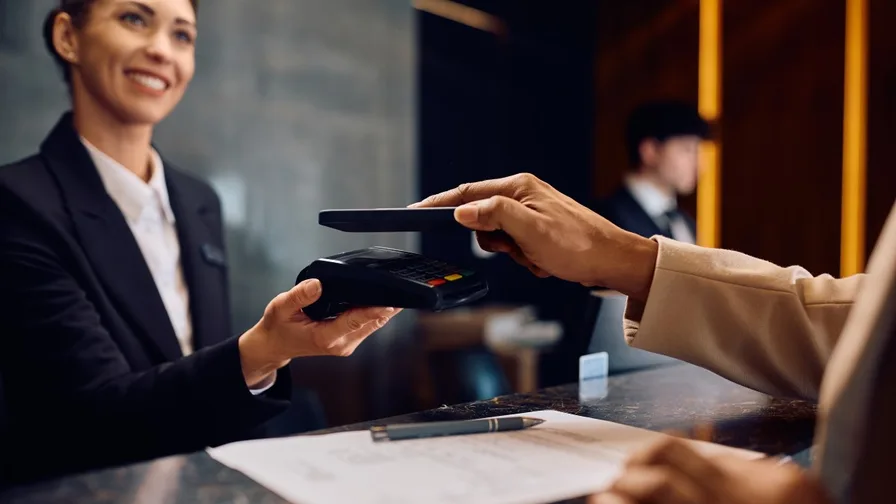 close up of a person using his mobile phone to make a digital payment