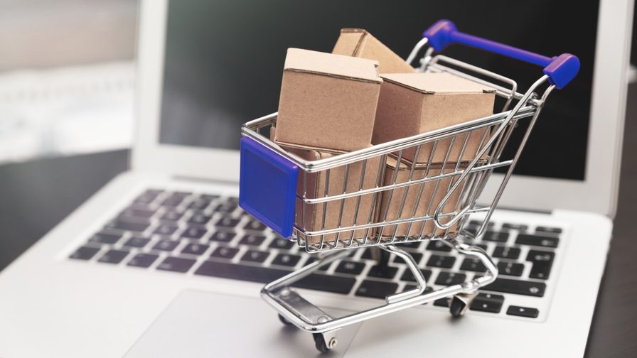 image of a full shopping cart on a laptop