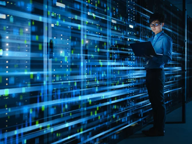 Image of man in front of data centre