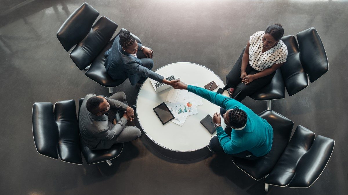 group of african businesspeople in a discussion around a table