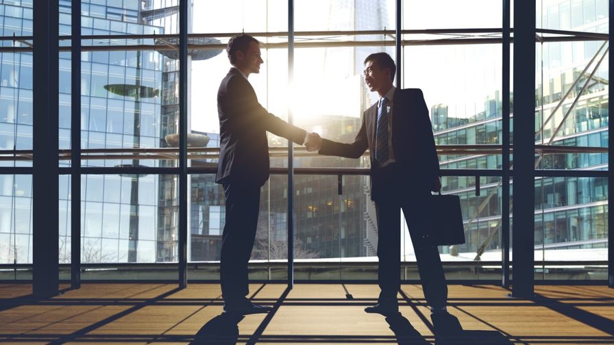 two businessmen shaking hands