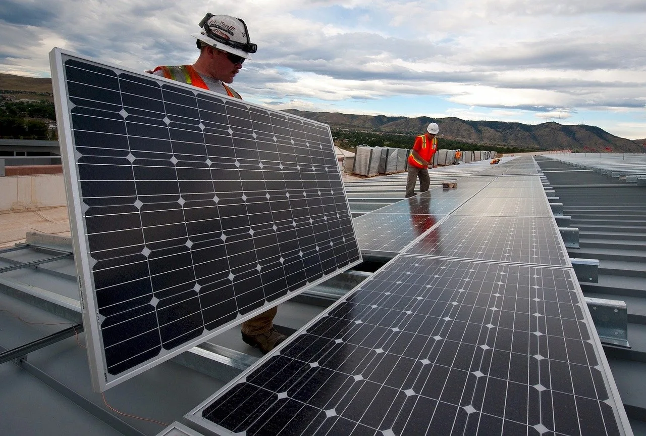 Workmen installing solar panels