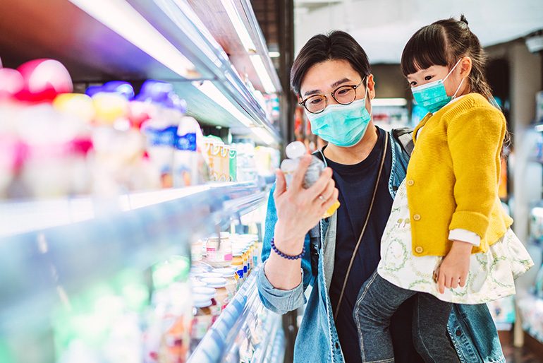 Image of man and child in a pharmacy