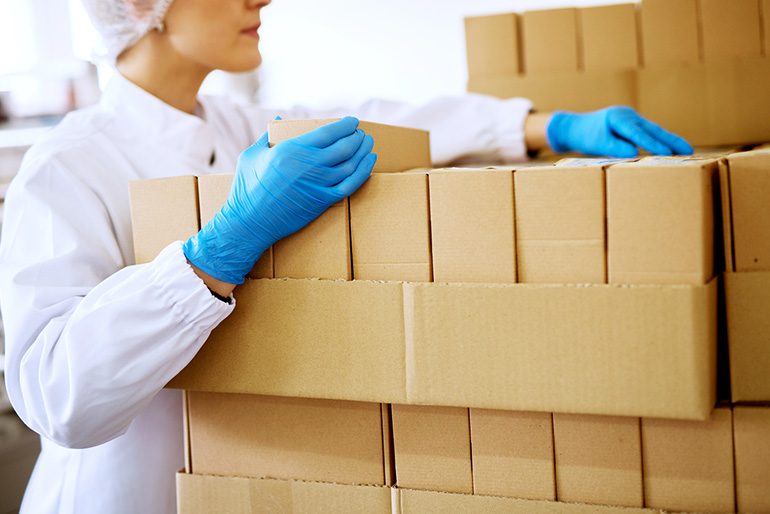 Image of woman unboxing a delivery