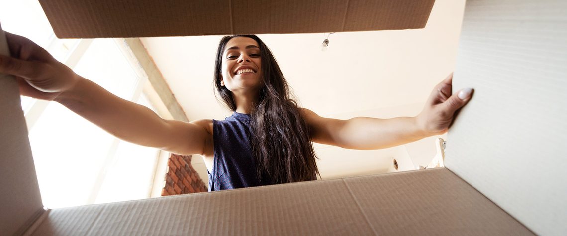 Image of woman opening a box