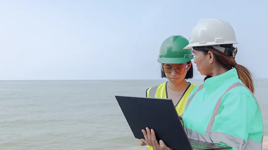 two women in safety helmets