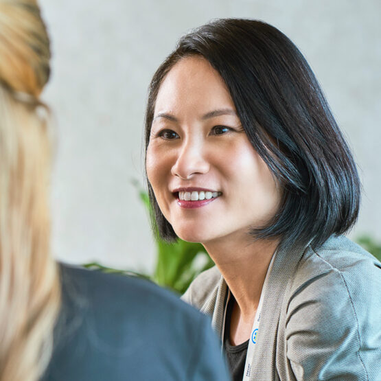 Smiling asian woman in a meeting