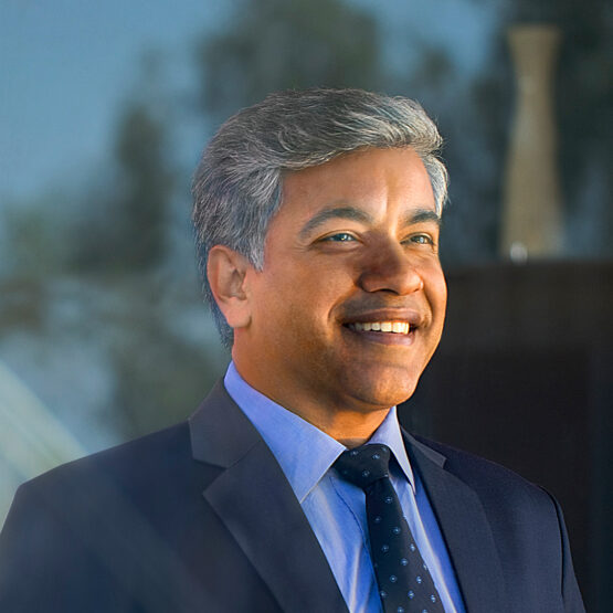 Businessman smiling with his hands clasped