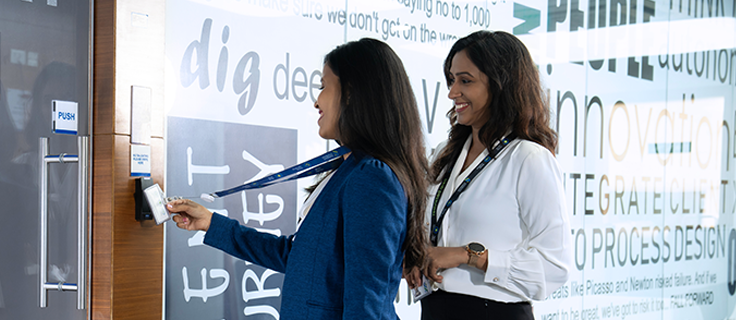 two people entering a meeting room
