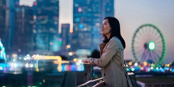 Person in front of cityscape 