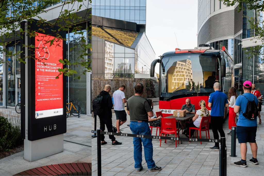 People waiting to enter the blood donation bus