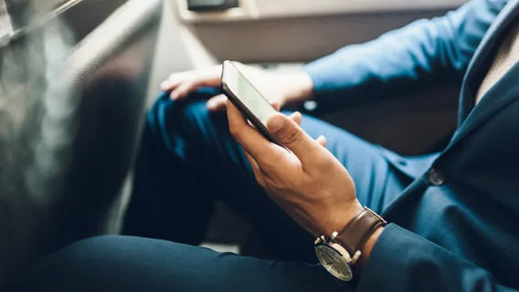 Image Businessman using mobile phone in car