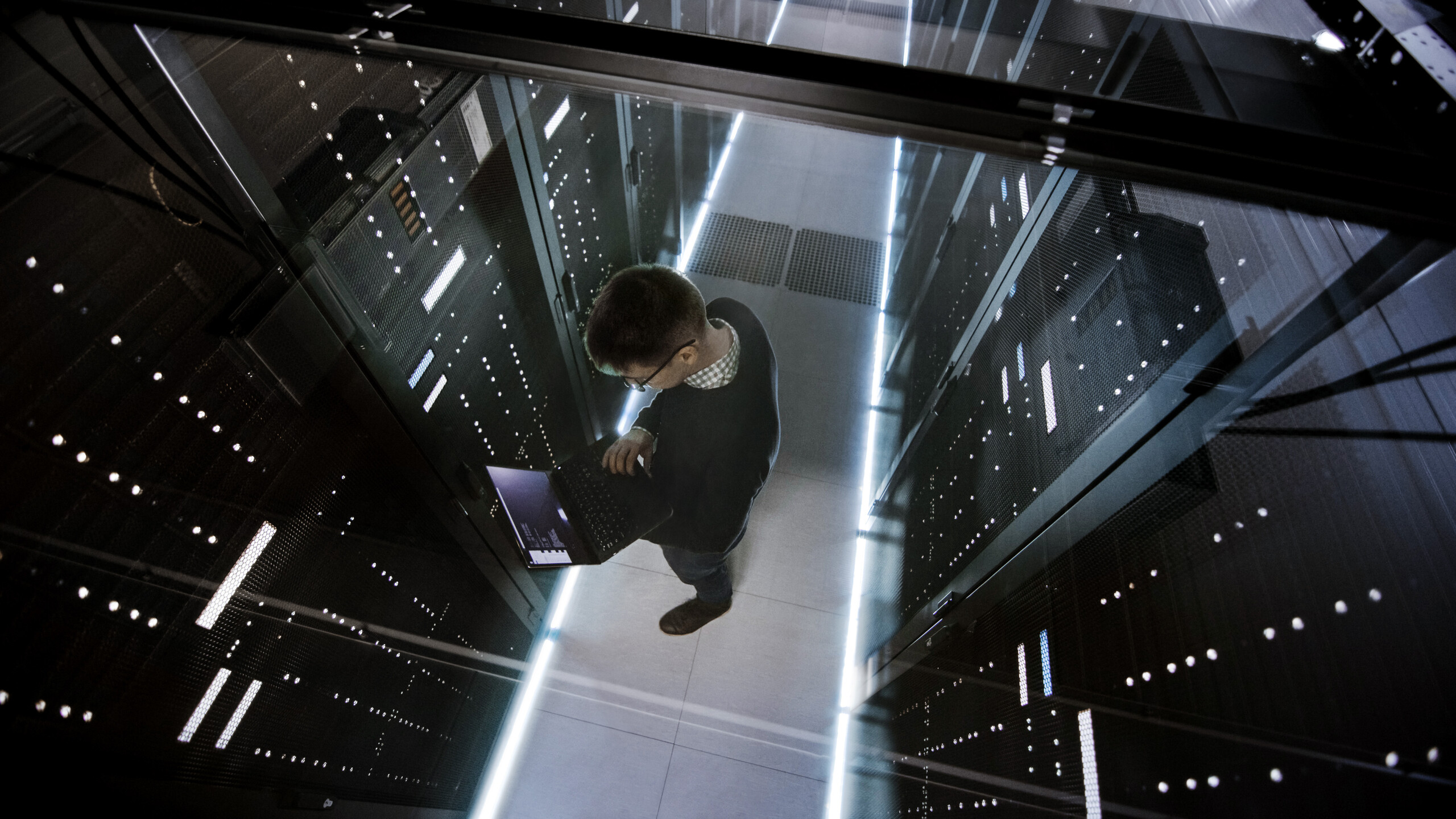 top down image of a man in a data centre server room