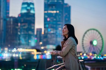 Person in front of cityscape