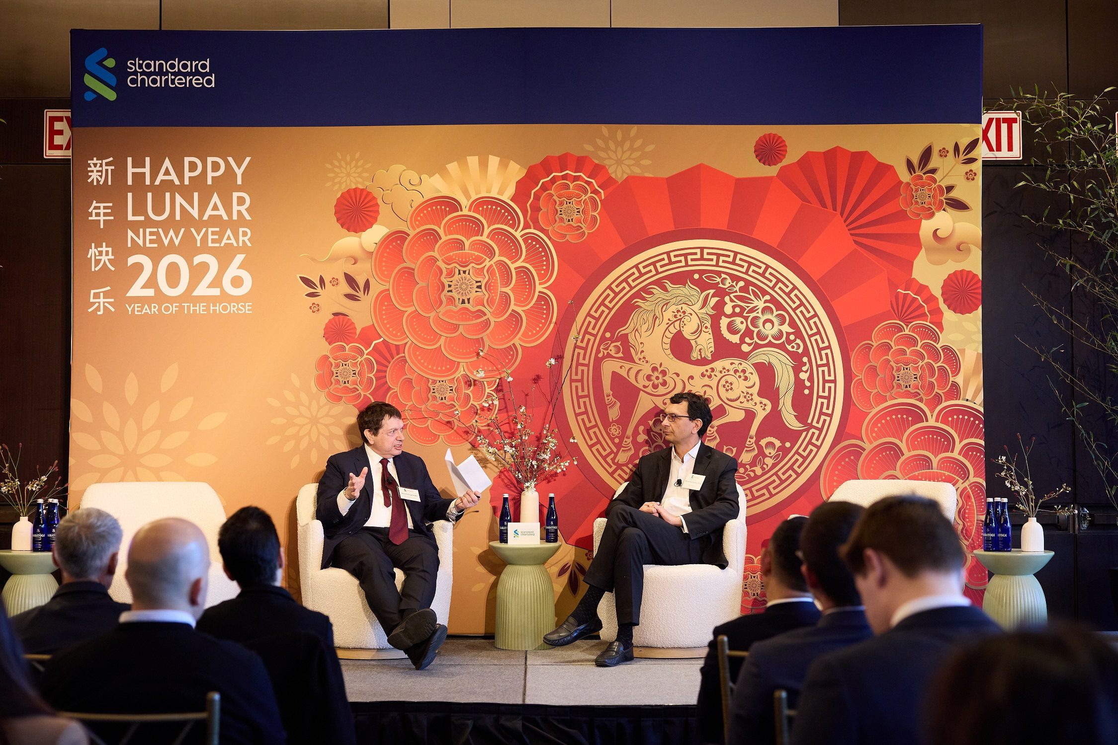 two people talking on stage