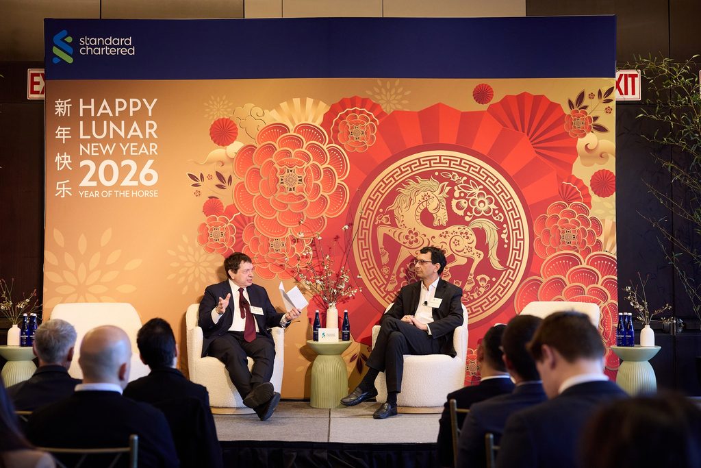 two people talking on stage